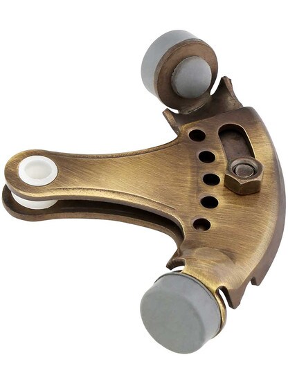 Solid Brass Adjustable Hinge Pin Door Stop in Antique Brass.